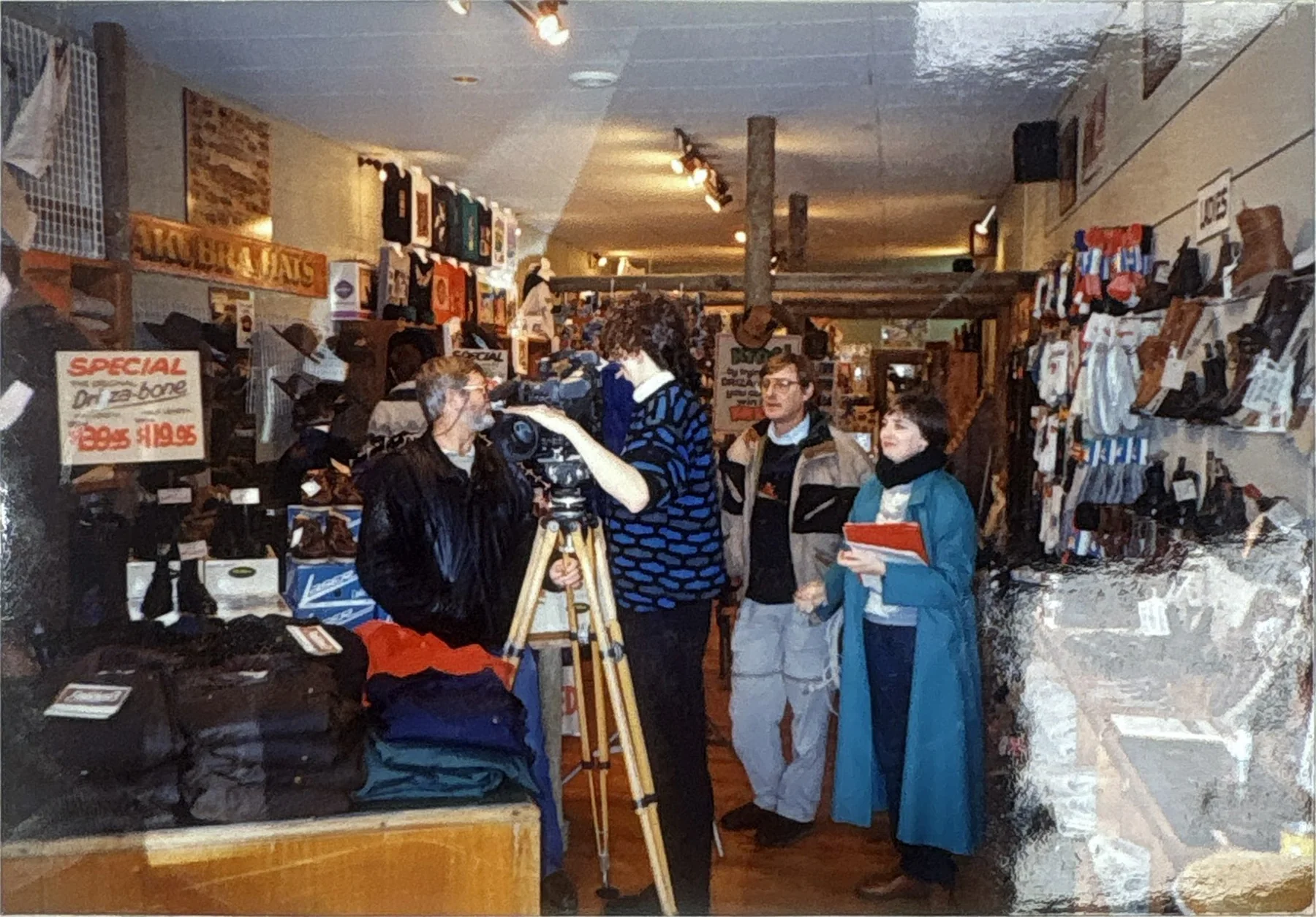 Customers and a film crew inside the original Sports Conscious store